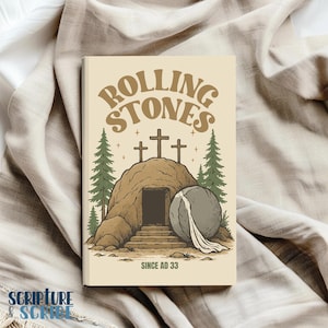 May include: A vintage-style illustration of a stone tomb with a large stone rolled away, revealing an open doorway. Three crosses are visible behind the tomb, and the text "Rolling Stones Since AD 33" is printed below the image.