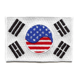 May include: White embroidered patch with the South Korean flag. The center circle features a yin-yang symbol with the American flag design.