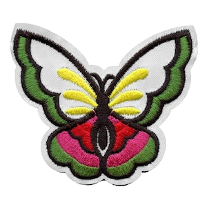 May include: Embroidered iron-on patch featuring a colorful butterfly with green, yellow, red, and pink accents.