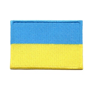 May include: A blue and yellow embroidered patch of the Ukrainian flag.