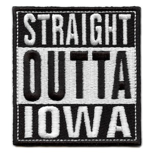 May include: Black and white embroidered patch with the text "STRAIGHT OUTTA IOWA" in a bold, blocky font.