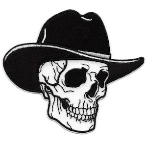 May include: Black and white embroidered patch featuring a skull wearing a cowboy hat. The skull is detailed with visible teeth and eye sockets. The hat is black with a white trim, creating a striking contrast. This patch is suitable for jackets, bags, or other apparel.