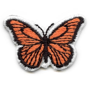 May include: Orange and black embroidered butterfly patch with white edging.
