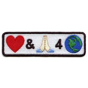 May include: White embroidered patch with a red heart, the ampersand symbol, two hands in a praying position, the number 4, and a blue globe with green continents.