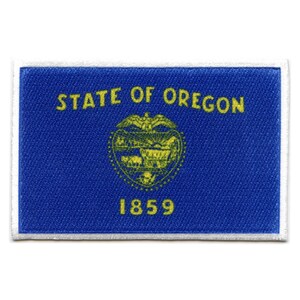 May include: A rectangular patch featuring the Oregon state flag design. The patch has a blue background with the words "STATE OF OREGON" and the year "1859" in yellow. A yellow emblem is in the center.