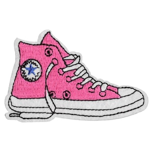 May include: Pink embroidered patch of a high-top sneaker with a white star on the side.
