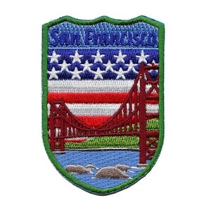 May include: Embroidered patch featuring the Golden Gate Bridge and an American flag with the text "San Francisco" in blue.