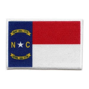 May include: A white patch with a blue rectangle on the left side and a red and white rectangle on the right side. The blue rectangle has a white star and the text "N*C" in white. The text "MAY 20th 1775" and "APRIL 12th 1776" are in yellow.