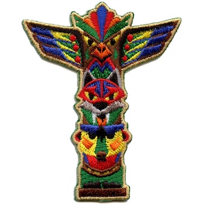 May include: A colorful embroidered patch depicting a Native American totem pole with a bird, wolf, and bear design. The pole is green with brown, red, yellow, blue, and white accents.
