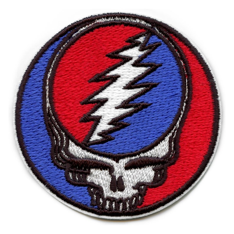 May include: An embroidered patch featuring the iconic Grateful Dead Steal Your Face logo. The skull is outlined in black with a white face and a red and blue lightning bolt inside.