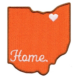 May include: Orange felt outline of the state of Ohio with a white heart in the upper right corner and the word "Home" in white cursive lettering.