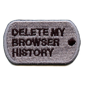May include: A gray military-style dog tag with the text "DELETE MY BROWSER HISTORY" embroidered in black.