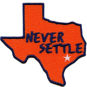 May include: Orange embroidered patch shaped like the state of Texas with the words "NEVER SETTLE" in navy blue lettering and a white star.