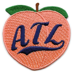 May include: Embroidered peach-shaped patch with the text "ATL" in navy blue cursive lettering.