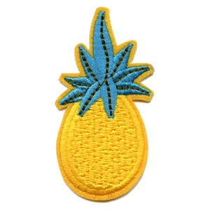 May include: A yellow embroidered pineapple with a blue and green leafy top.