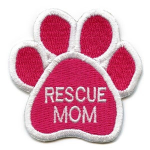 May include: Pink paw print embroidered patch with white outline and the text "RESCUE MOM" in white.