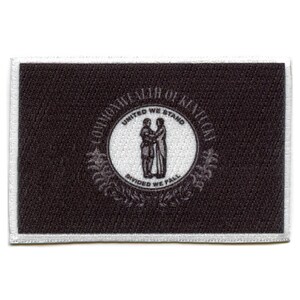 May include: Black and white embroidered patch of the Commonwealth of Kentucky seal. The seal features two figures shaking hands with the text "United We Stand, Divided We Fall".