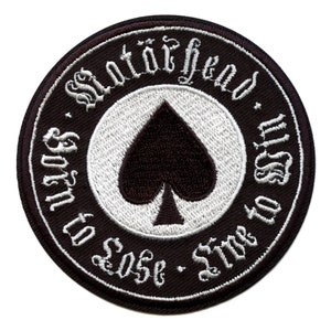 May include: Black and white embroidered patch with a spade in the center and the text "Satan's Born to Lose - Time to Sin" around the spade.