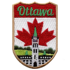 May include: Embroidered patch with a tan border, featuring a red maple leaf, a white building with a green spire, and the text "Ottawa" in green letters on a red background.