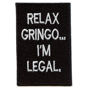 May include: Black embroidered patch with white text that reads "Relax Gringo... I'm Legal."