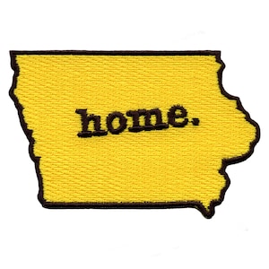 May include: Yellow embroidered patch in the shape of the state of Iowa with the word "home" in black lettering.