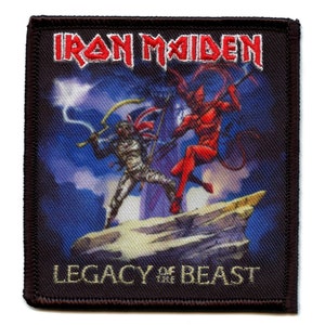 May include: Iron Maiden band patch with a black background, a red devil with a trident, and a warrior with a sword. The text "LEGACY OF THE BEAST" is at the bottom of the patch.