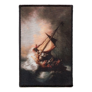 May include: A woven tapestry patch depicting a ship caught in a storm. The ship is tilted at a sharp angle, with the mast and sails straining against the wind. The waves are crashing around the ship, and the sky is dark and stormy. The patch is framed with a black border.