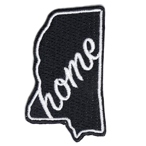 May include: Black embroidered patch shaped like the state of Mississippi with the word "home" in white cursive lettering.