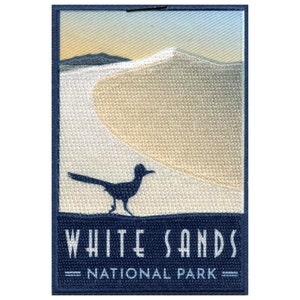 May include: A blue embroidered patch with a silhouette of a roadrunner bird in front of a white sand dune. The text "WHITE SANDS NATIONAL PARK" is printed in white on a blue background.