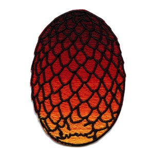 May include: Embroidered patch in the shape of a dragon egg. The egg features a gradient of colors, transitioning from dark red to orange and yellow. The design includes a black, scale-like pattern.
