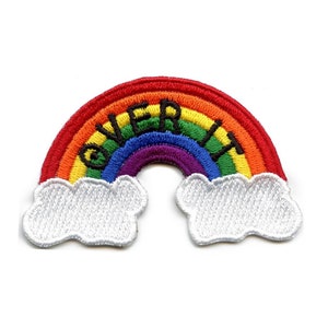 May include: Rainbow-colored embroidered patch with the word "OVER IT" in black lettering. The rainbow is arched over two white clouds.