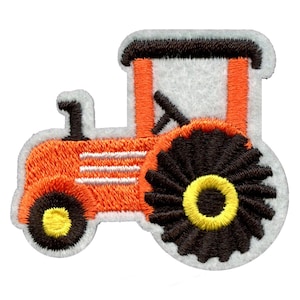 May include: Orange and black embroidered tractor patch with white details. The tractor has a large back wheel and a smaller front wheel.