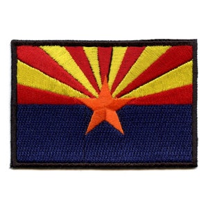 May include: An embroidered patch featuring the Arizona state flag. The flag is a red and yellow sunburst design with a red five-pointed star on a blue background.