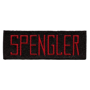 May include: Black fabric patch with the word "SPENGLER" embroidered in red.