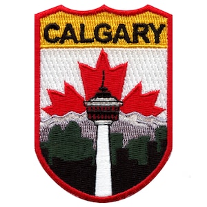 May include: Embroidered patch with a red maple leaf, a white tower, and a green and black cityscape. The patch has a yellow banner at the top that reads "CALGARY".