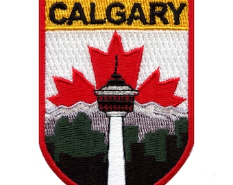 May include: Embroidered patch with a red maple leaf, a white tower, and a green and black cityscape. The patch has a yellow banner at the top that reads "CALGARY".