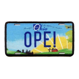 May include: A blue and yellow patch with a black border. The patch is shaped like a license plate and says "Ohio" and "OPE!" in blue letters.