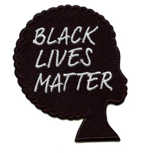 May include: Black silhouette of a person with an afro hairstyle. The text "Black Lives Matter" is embroidered in white on the silhouette.