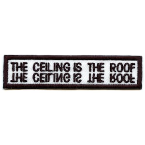 May include: White embroidered patch with brown stitching. The text on the patch reads "THE CEILING IS THE ROOF THE CEILING IS THE ROOF".