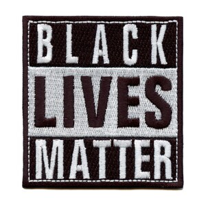 May include: Black Lives Matter embroidered patch with white lettering on a black background.