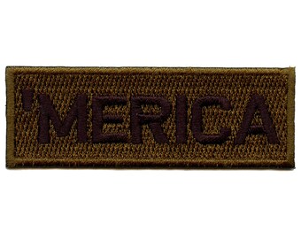 May include: A brown rectangular patch with the word "MERICA" embroidered in dark brown thread.