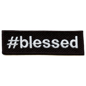 May include: Black embroidered patch with white text that reads "#blessed".