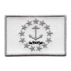 May include: White embroidered patch with a gray anchor and a circle of 13 stars. The anchor is centered in the circle of stars. The patch has a white border.
