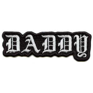 May include: White embroidered "DADDY" text on a black patch.
