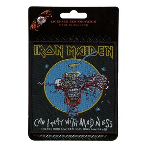 May include: Iron Maiden band logo patch with a black background, blue circle, and a colorful graphic of a head with a microphone. The text "Can I Play With Madness" is below the graphic. The text "2021 Iron Maiden LLP Iron Maiden" is below the text.