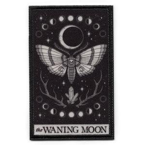 May include: Black and white embroidered patch with a moth and crescent moon design. The text "the WANING MOON" is at the bottom of the patch.