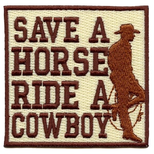 May include: Embroidered patch with the text "SAVE A HORSE RIDE A COWBOY" in brown letters on a cream background. A brown cowboy silhouette leans against the right side. The patch has a brown border.