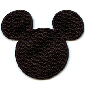 May include: Brown felt Mickey Mouse head silhouette patch.