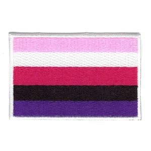 May include: A rectangular embroidered patch with five horizontal stripes in pink, white, red, black, and purple. The patch has a white border.