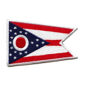 May include: A red, white, and blue embroidered patch of the Ohio state flag. The flag features a blue triangle with 17 white stars and a red circle in the center. The triangle is on top of three horizontal stripes of red, white, and red.